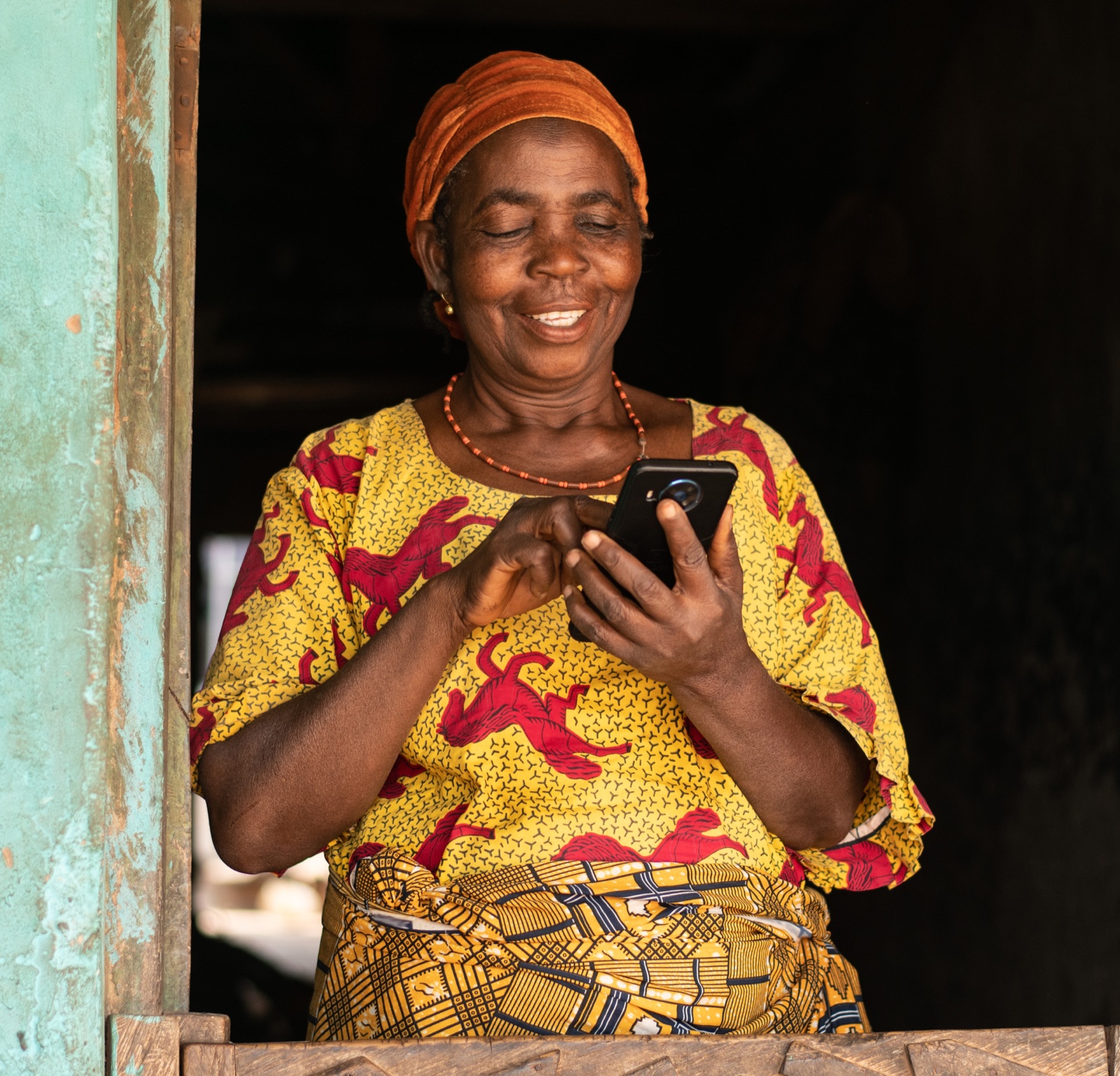 A shop owner using her mobile phone at her stall