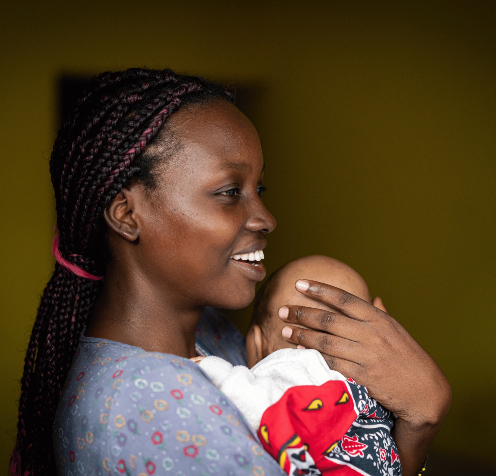 A mother holding her baby