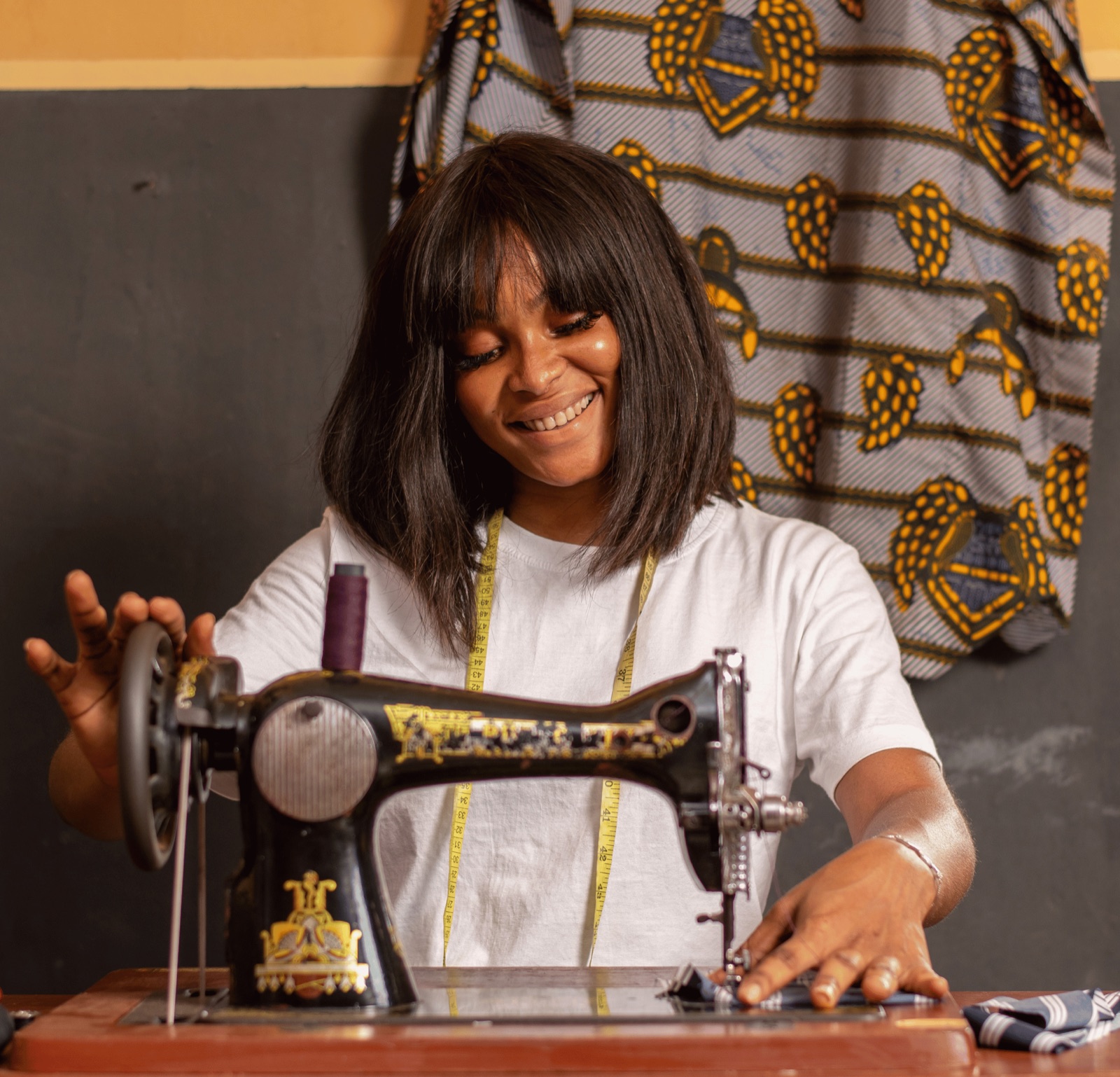 A woman working at a sewing machine