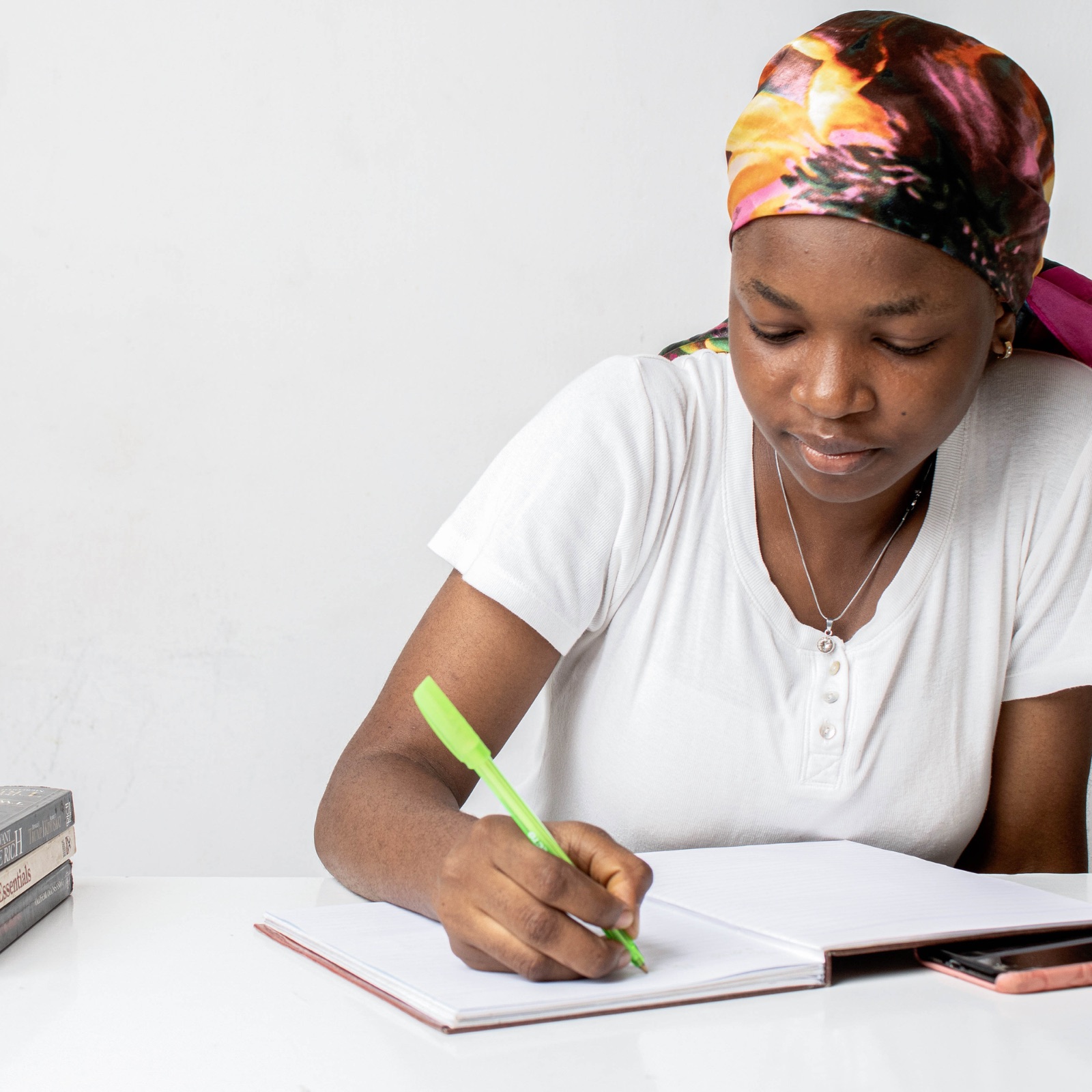 A young woman studying and taking notes